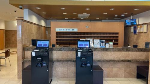 a lobby with two atm machines in a store at Toyoko Inn Kagoshima Temmonkan No 2 in Kagoshima