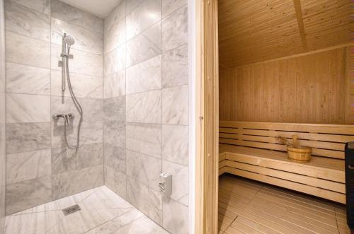 a bathroom with a walk in shower and a walk in shower at Prestige 504 2 BED in Paphos