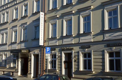 a building with a parking sign in front of it at Metropolitan Boutique Hotel in Krakow