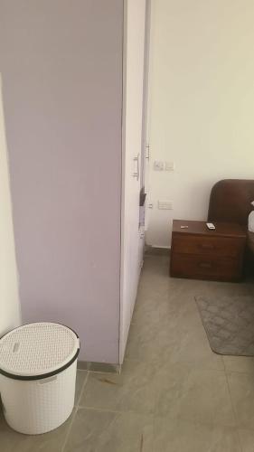 a living room with a couch and a table at Mena apartment in Malindi