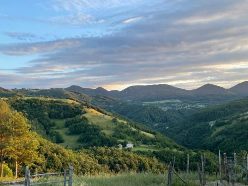 a view of a valley with mountains and trees at Bosco Stellato in Casteldelci