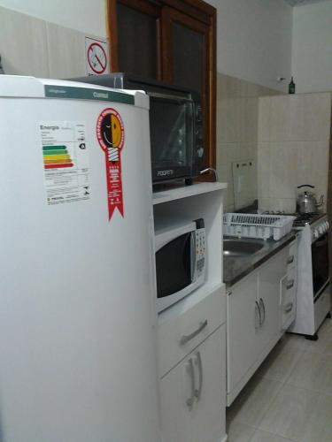 Dapur atau dapur kecil di Residencial Ostras