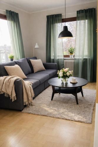 a living room with a couch and a coffee table at Annie Järdebergsgatan 3 in Kiruna