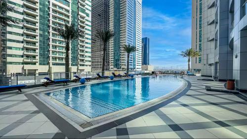 Vogue Vacation Homes, Marina Torch Tower near JBR Beach and Dubai Marina Mall, Two Bedroom Apartment with Balcony and City Skyline View, Access to all Amenities
