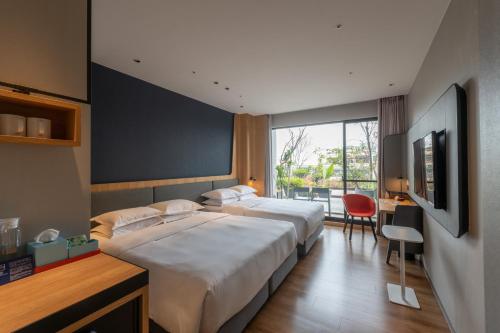 Holiday Inn Express Chiayi by IHG 객실 침대