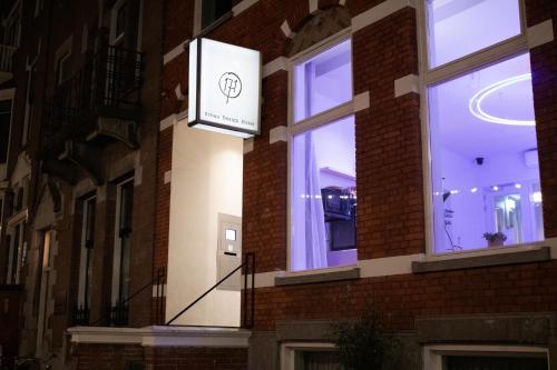 a sign on the side of a brick building at Hotel 171 in Rotterdam