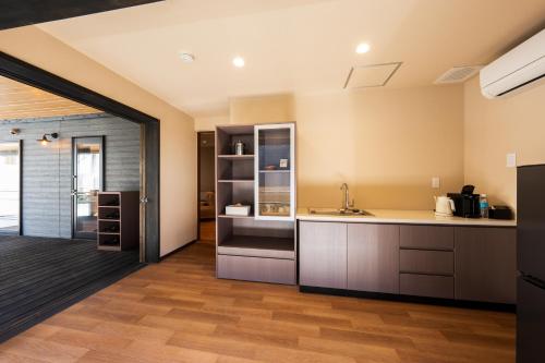a kitchen with a sink and a counter at Umine Annex in Beppu
