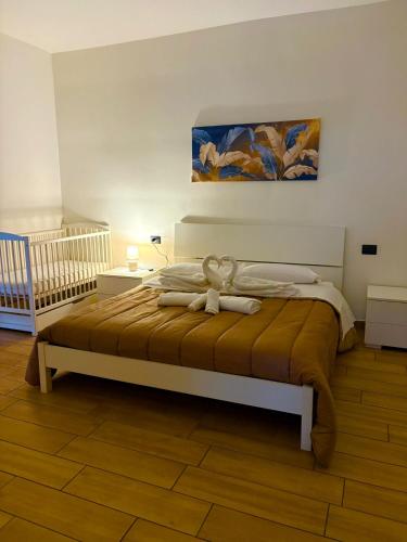 a bedroom with a bed with a stuffed animal on it at Residenza Mazzini in Avezzano
