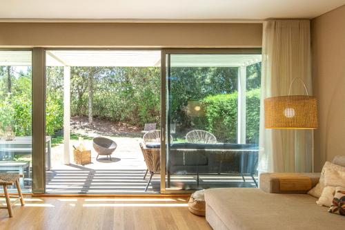 a living room with a large sliding glass door at Villa Mar in Troia