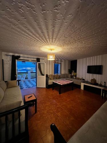 a living room with a couch and a table at CHY dreams in Cabo Negro