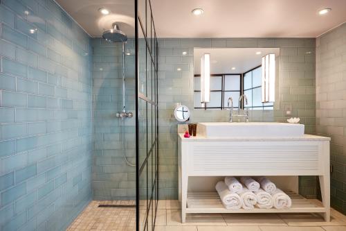 a bathroom with a sink and a mirror at Seaham Hall and Serenity Spa in Seaham