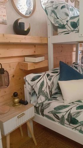 a bedroom with a bunk bed and a table at La Casita de Lledó in Vilafamés
