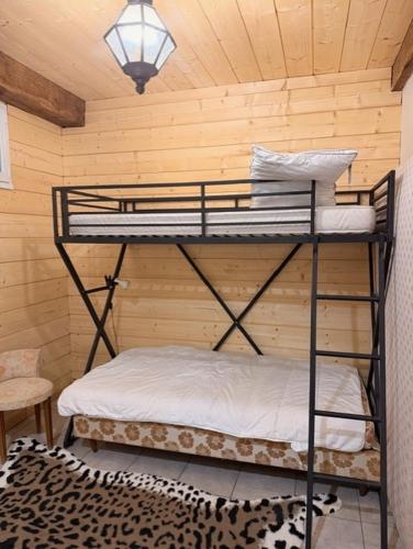 a room with two bunk beds in a room at La Bastide in Armous-et-Cau