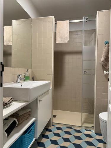 a bathroom with a sink and a shower at Casa Clara in Castelo de Vide