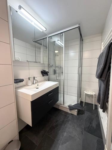 a bathroom with a sink and a shower at Bergquelle 2. OG in Bettmeralp