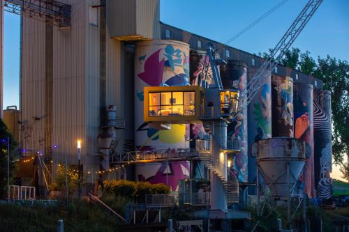 a building with a mural on the side of it at De Bossche Kraan in Den Bosch