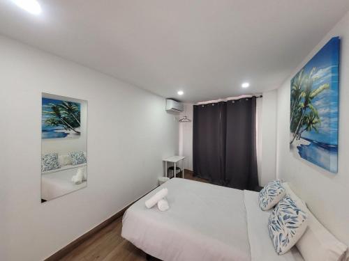 เตียงในห้องที่ AYZ Elcano - Auto check-in property