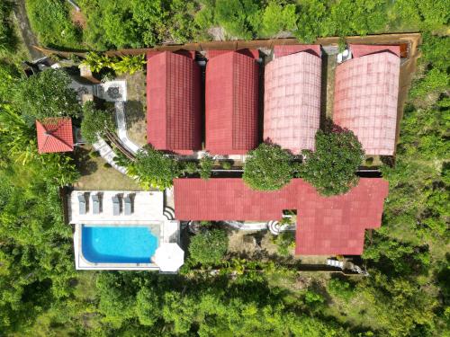 an overhead view of a building with a pool at Kubu Diar by Manara in Seraya