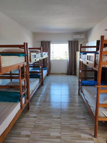 a room with a bunch of bunk beds at Hostel Vista Mar in Porto Seguro