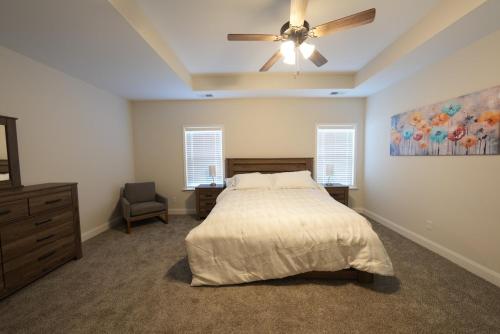 a bedroom with a bed and a ceiling fan at Desoto Rental in Olive Branch