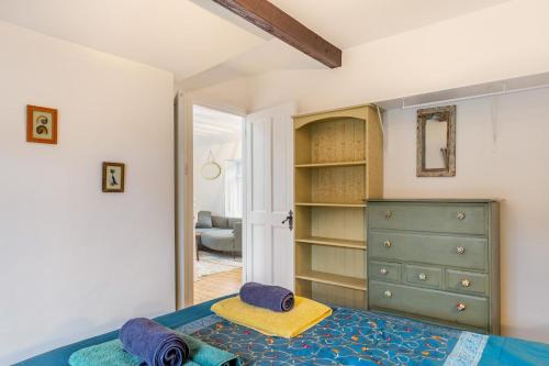 a bedroom with a bed and a dresser at 2 Bed in Lynton oc-s33456 in Lynmouth