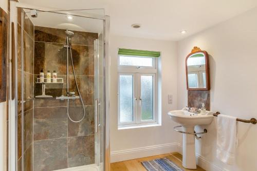 a bathroom with a shower and a sink at 2 Bed in Lynton oc-s33456 in Lynmouth