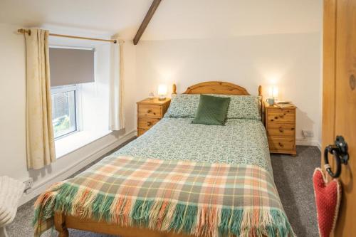 a bedroom with a bed and a window at 2 Bed in Trefil oc-n34478 in Nant-y-bwch