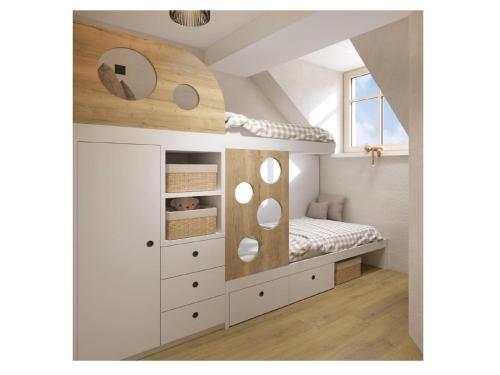 a bedroom with a bunk bed in a attic at Golf Apartments in Kranjska Gora