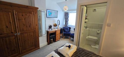 a bathroom with a shower and a sink and a toilet at Toulson Court in Scarborough