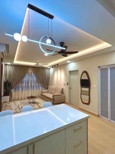 a living room with a couch and a ceiling fan at Julia HavenStay, Sepang KLIA in Sepang