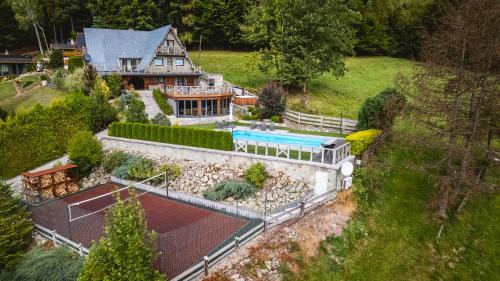 an aerial view of a house with a swimming pool at Dom Beskidy in Brenna