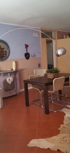 a living room with a table and chairs at Charlotte room in Bassano del Grappa