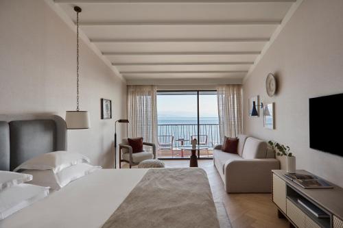 a hotel room with a bed and a view of the ocean at Amadria Park Grand Hotel 4 Opatijska Cvijeta in Opatija