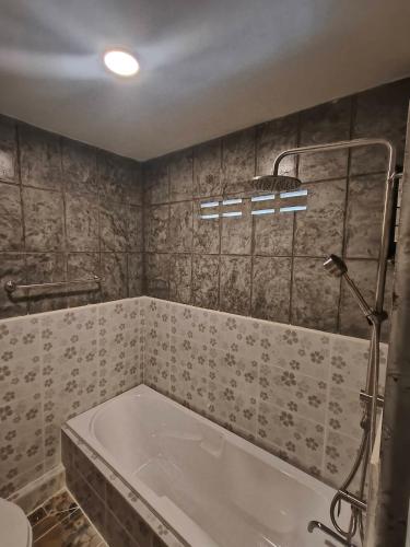 a bathroom with a tub and a shower at Libong haven in Ko Kwang