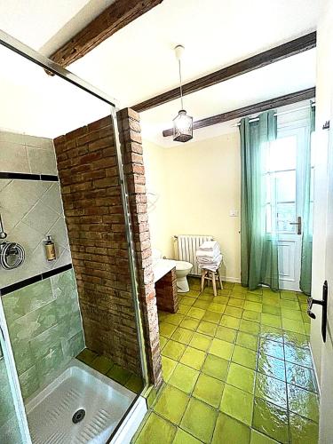 a bathroom with a walk in shower and a glass shower at Cà VENDALIS Agriturismo & Cantina in Cinto Euganeo