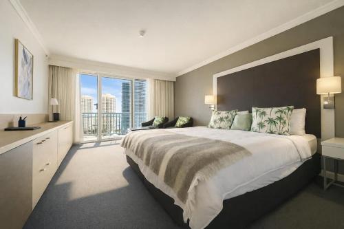 a large bedroom with a large bed and a large window at L19 Ocean View Suite - King Bed Wi-Fi in Gold Coast
