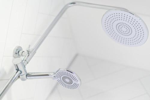 a shower with a shower head in a bathroom at Ellaburn in Barry