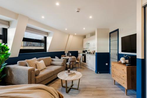 a living room with a couch and a table at Your Apartment I Clifton Village in Bristol