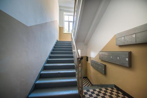 a staircase in a building with blue steps at AmberHome in Liepāja