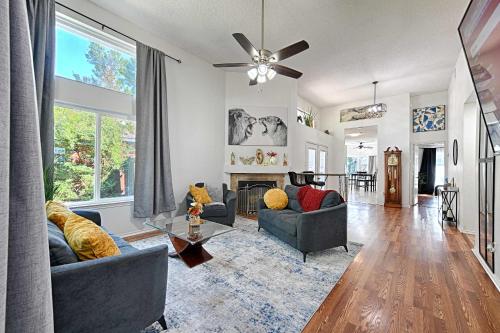 a living room with two couches and a fireplace at Little House in the Prairie in Grand Prairie