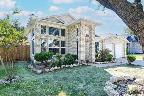 a large house with a yard in front of it at Little House in the Prairie in Grand Prairie