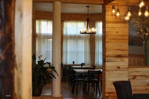 a dining room with a table and chairs at Roam Inn in Munising
