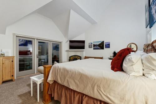 a bedroom with a large bed and a tv at The Rest in Jackson