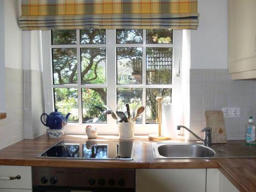a kitchen counter with a sink and a window at Viktor-Jaeger-Stiftung in Nebel
