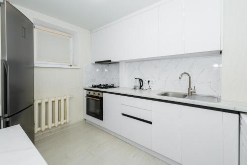 Cuina o zona de cuina de Nice white apartment