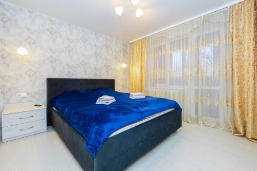 Llit o llits en una habitació de Nice white apartment
