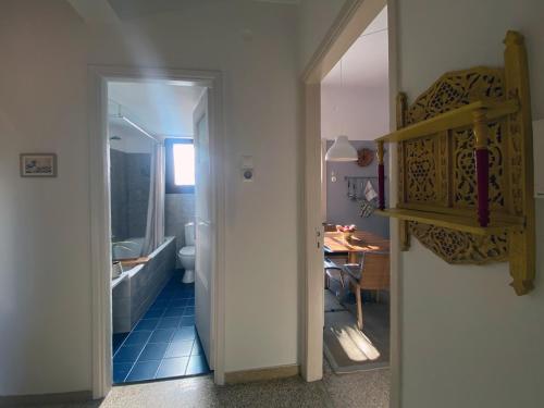 a hallway with a bathroom and a dining room at Bamboo & Bird House, Chalandri in Athens