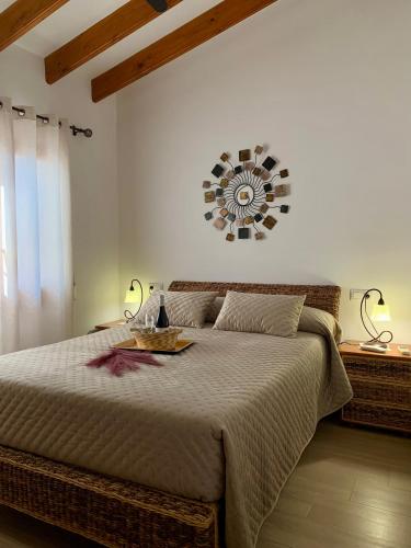 a bedroom with a bed and a mirror on the wall at Casa Laura by Sun & Sea Homes in Moraira
