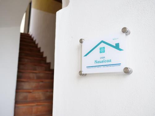 a sign on the side of a house on a wall at Casa Nausicaa in Pergine Valsugana