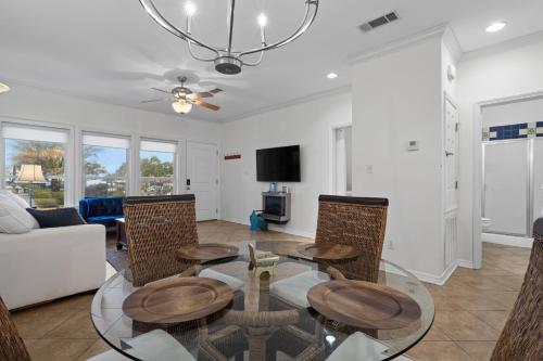 a living room with a table and chairs at Steps from the Sand and Town Green - 2BR Coastal Retreat in Long Beach